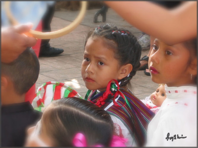 Little girl dressed up for Independence Day parade along with other Ajijic people.