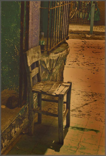 Digital photograph of a chair in yellow with green background created by Photographer Jill Flyer.