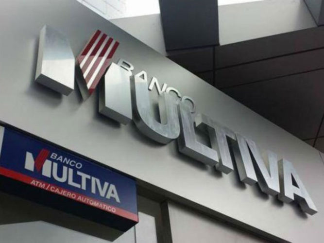 banco multiva blue red white and silver corporate lettering and sign above bank entrance