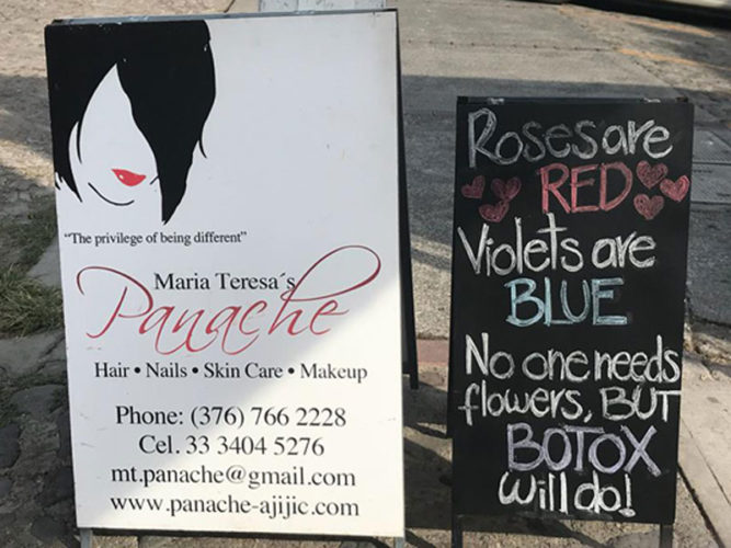 Panache Hair and Skincare Studio sandwich board sign with contact information and blackboard beside it with cute saying