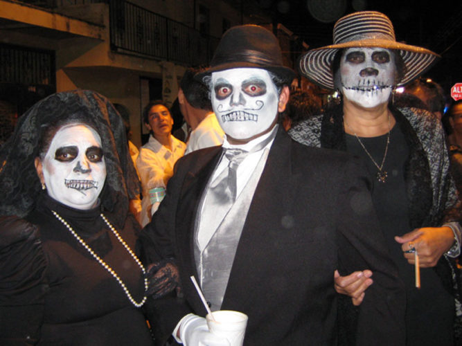 Three people dressed as Catrinas for Day of the Dead parade in Ajijic.