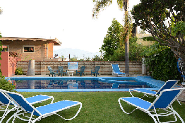 Pool with lounge chairs at Casa de la Abuela.